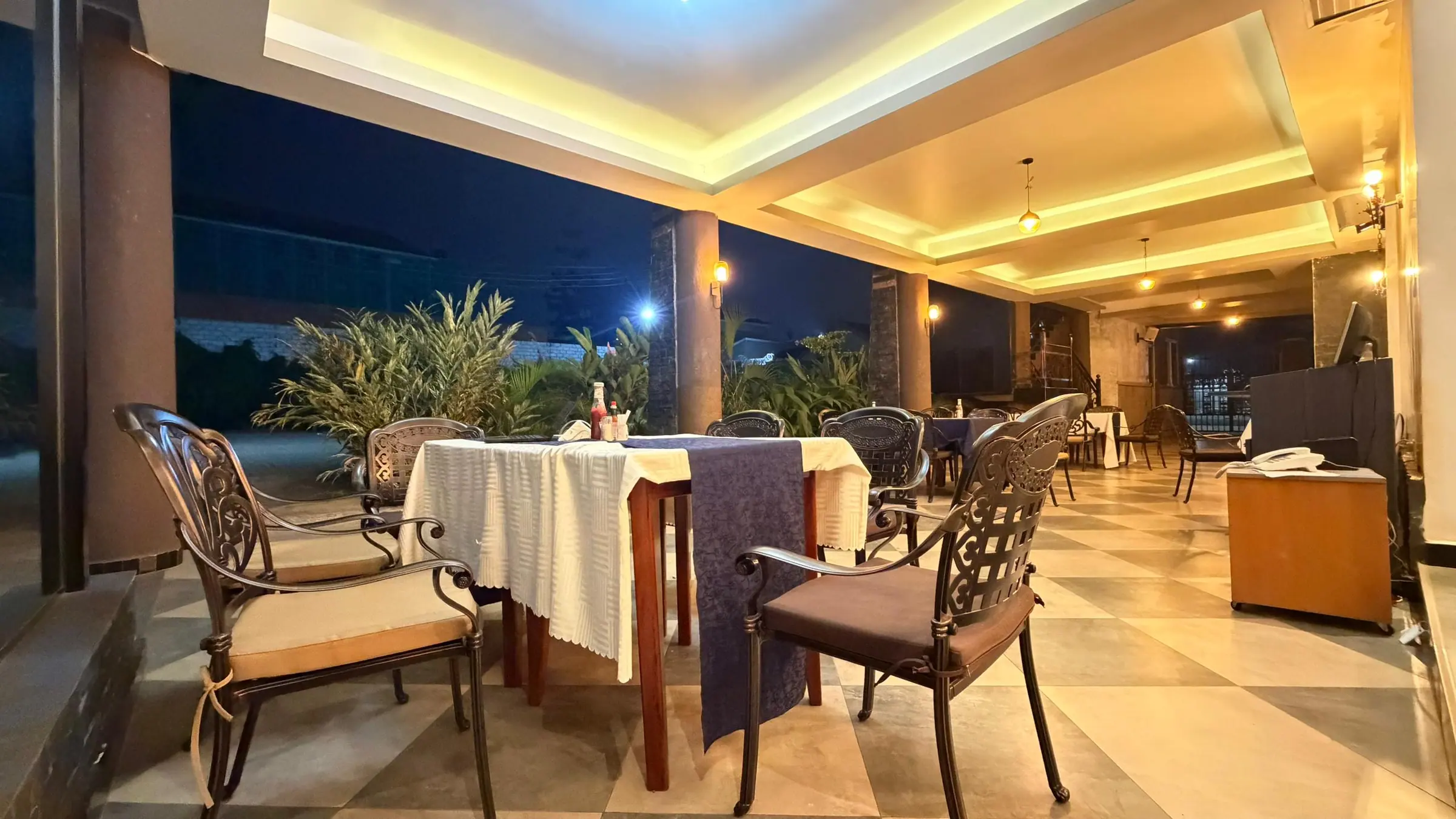 The restaurant in the evening, with linen-set tables and warm lighting